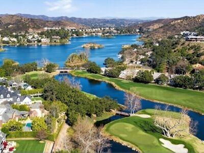 The house near the lake, in the oak-shaded hills of Ventura County, behind a single iron gate, lies Sherwood Country Club Estates